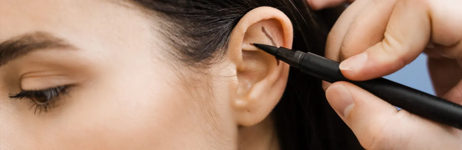 A woman preparing for her cosmetic ear surgery