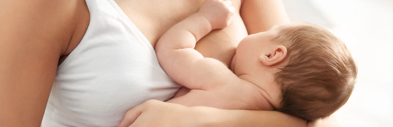 A woman breastfeeding her child