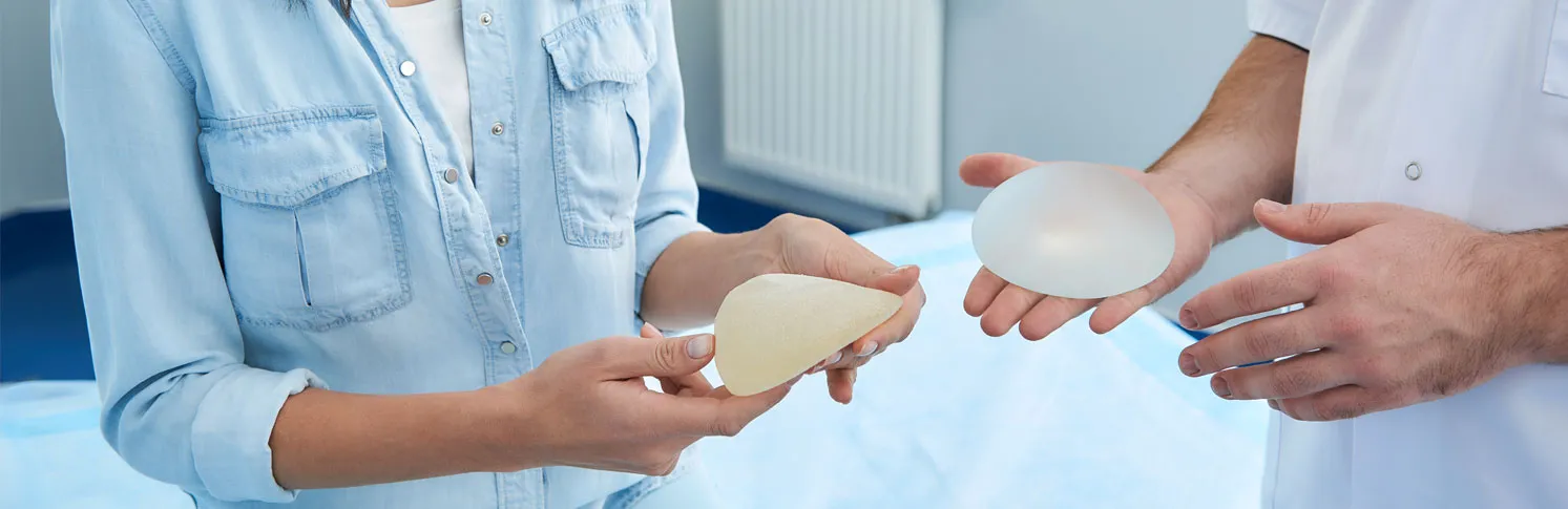 A patient assessing her breast augmentation options with a specialist