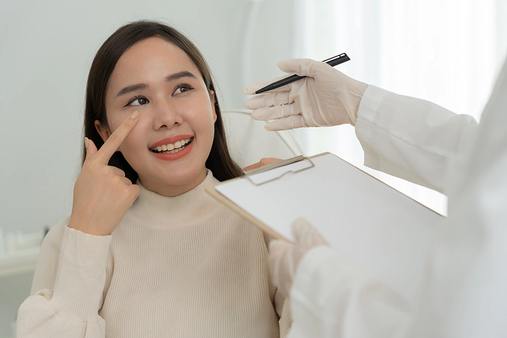 A patient reviewing the results of her cosmetic surgery with her surgeon