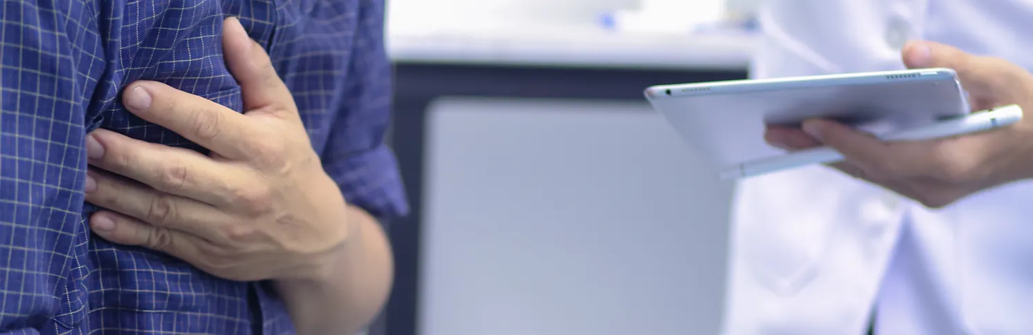 A man consulting a doctor for gynaecomastia guidance